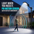 A modern outdoor LED street light mounted on a pole beside a house at dusk, with a man walking under its beam. The image includes marketing text reading 'LIGHT WHEN YOU NEED IT.