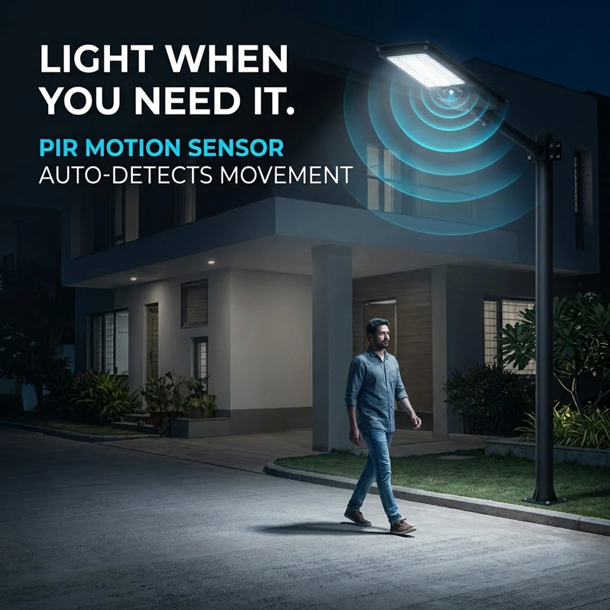 A modern outdoor LED street light with a black pole is shown at night beside a house, illuminating a walkway. A man is walking under the light, and blue graphic wave lines indicate motion detection.
