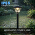 Outdoor garden light fixture in a rain-soaked garden with waterproof rating text.